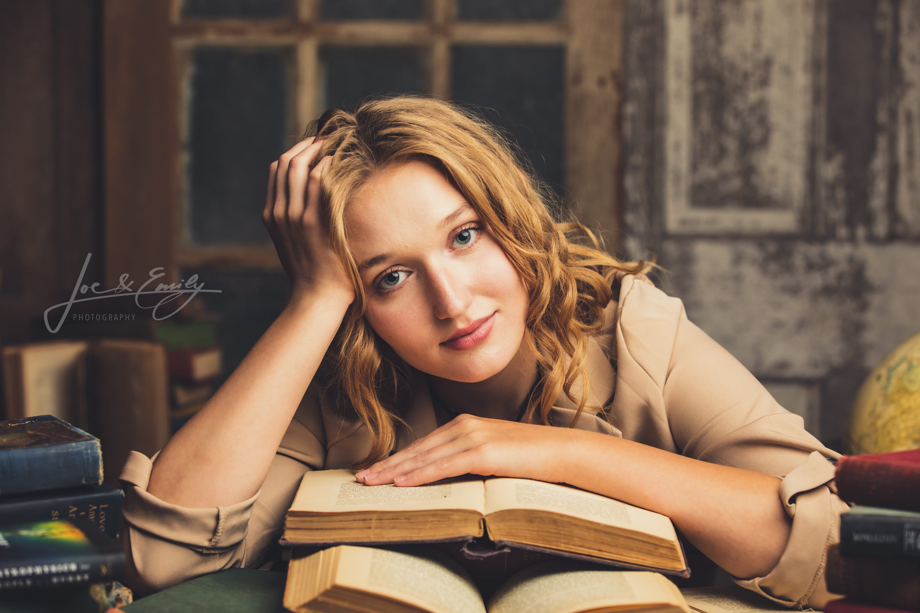 Girl laying on books
