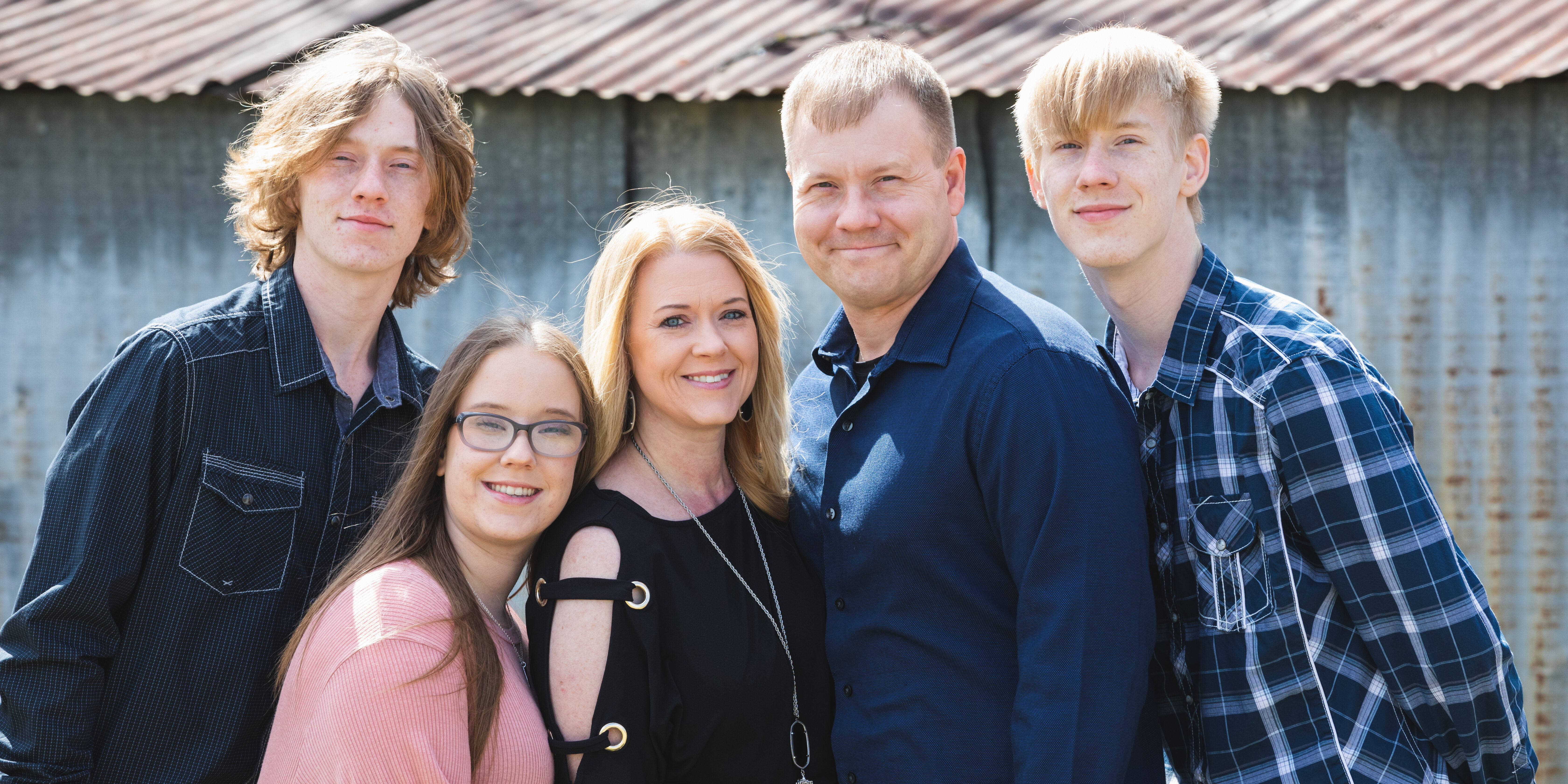 Family in front of barn