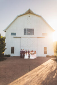 Bridal party outside of barn