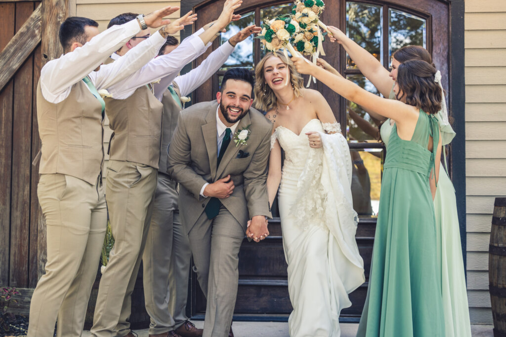 Bride and Groom running through Bridal party tunnel