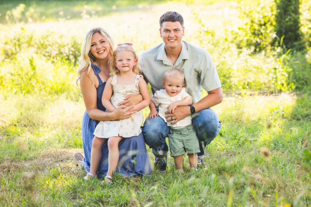 Family sitting in the field