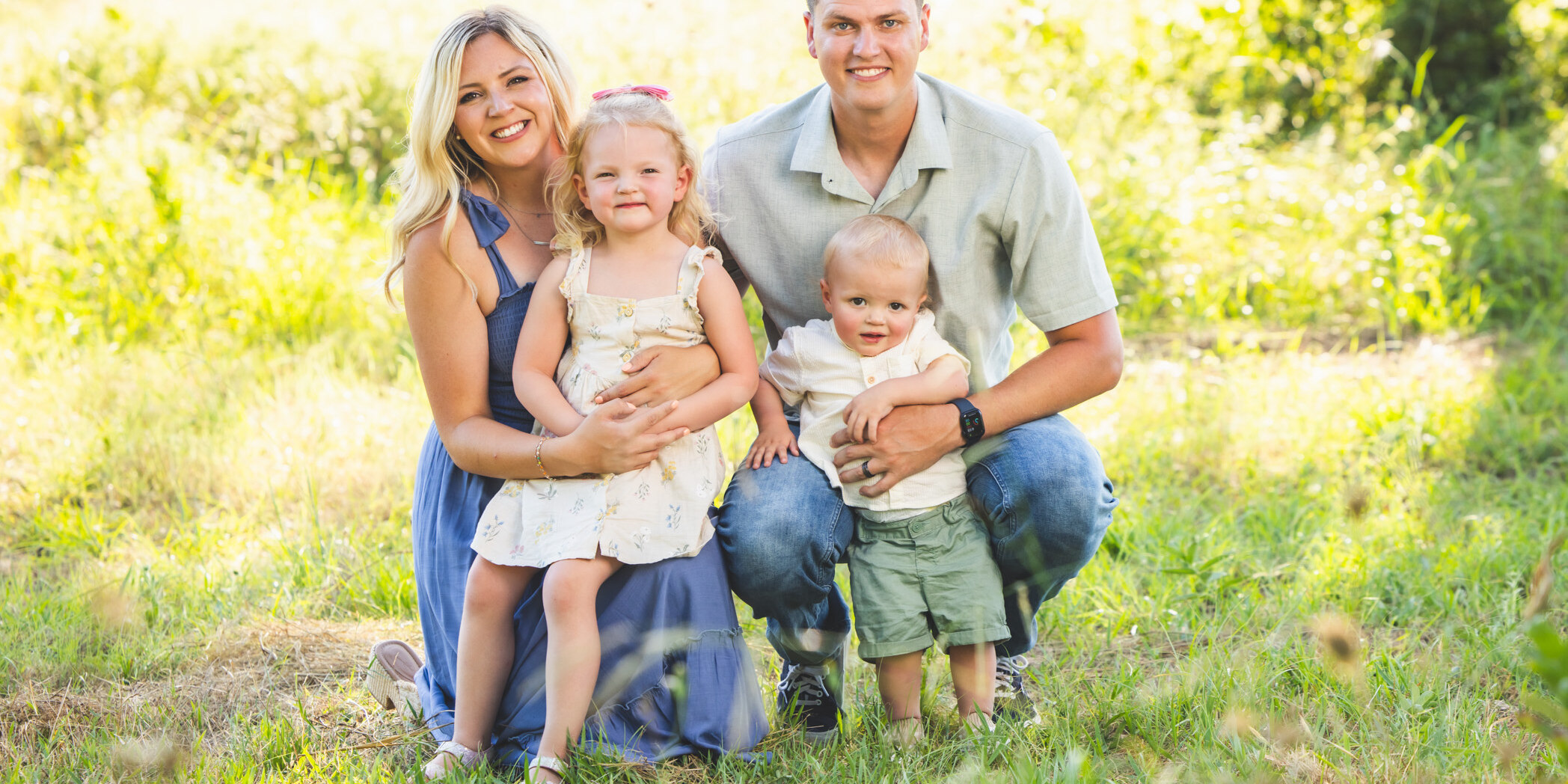 Family sitting in the field