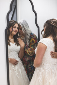 Bride and Mom looking into mirror