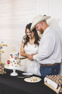 Bride and groom cutting cake
