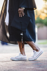 Girl walking with her cap on her side