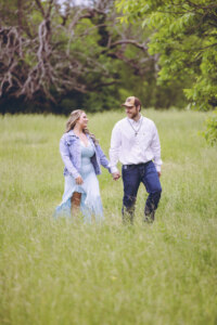Couple walking through field