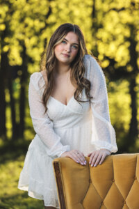 Girl leaning on a chair