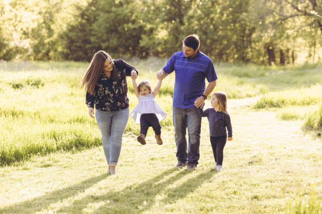 Family walking in a field